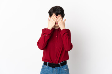 Woman with short hair isolated on white background covering eyes by hands