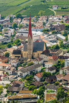 Superb vertical aerial view of the old town of Silandro, South Tyrol, Italy, on a sunny day
