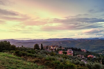 Fototapeta na wymiar Epic Morning Sky Over Tuscany Landscape with Village