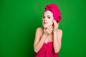Close-up portrait of nice pretty lady wearing turban using facial mask preparing isolated over...