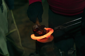 Incandescent horseshoe on the anvil