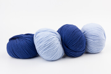 woolen merinos blue threads on white background. natural wool. knitting. background