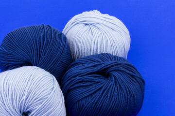 woolen merinos blue threads on blue background. natural wool. knitting. background