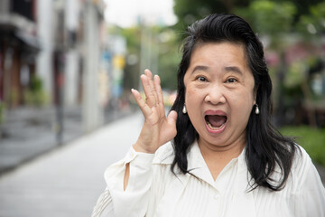 portrait of negative, excited, surprised old senior woman