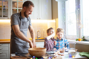 Young family making cookies at home