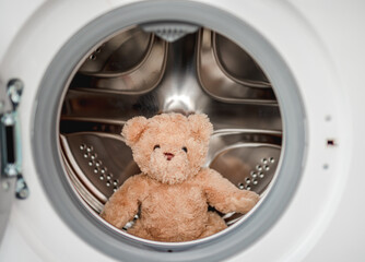 Plush teddy bear after washing in machine