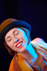 Portrait of middle-aged woman with hat. Ugly model in yellow autumn stile posing in studio.