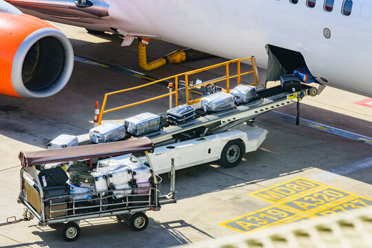 Loading luggage in airplane at the airport in Antalya city, Turkey