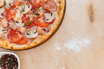 Delicious Italian pizza made according to this recipe. Sprinkled with mozzarella on top. Decomposed...