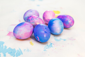 Blue and pink Easter eggs top view. Beautiful Easter composition. Easter card. Multicolored eggs on a white background
