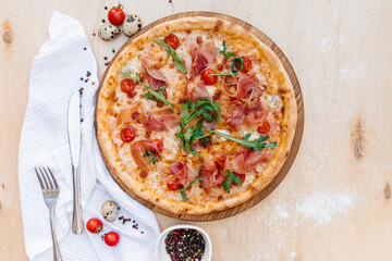 Delicious Italian pizza made according to this recipe. Sprinkled with mozzarella on top. Decomposed ingredients nvkolo. There is a place to write text. Professional photography of goods.