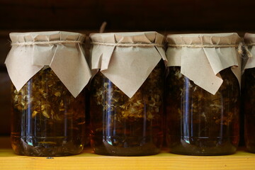 Jar of jam on a wooden shelf