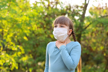 Little girl suffering from allergy outdoors