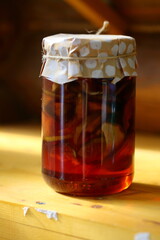 Jar of jam on a wooden shelf