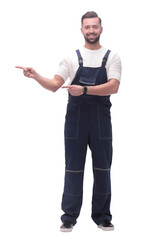 smiling man in overalls pointing to a copy of the space