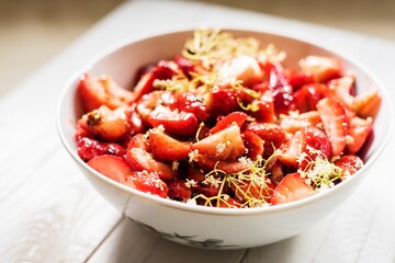 Summer strawberry salad with balsamic vinegar and elderberry flowers