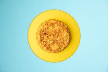 omelette with potatoes on blue background