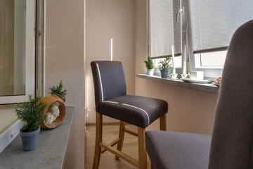 dinner tea table with chairs on the loggia in light interior