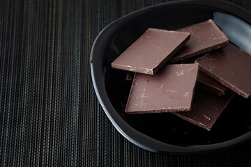 Pieces of dark broken chocolate