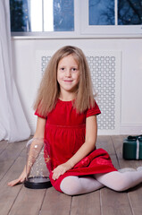 Little girl sits on the flor