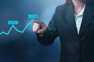 Business development year 2021 goal concept, Businessman pointing graph corporate future growth up plan from 2020