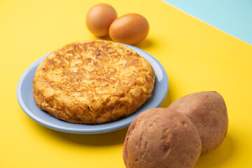 omelette with potatoes on yellow background