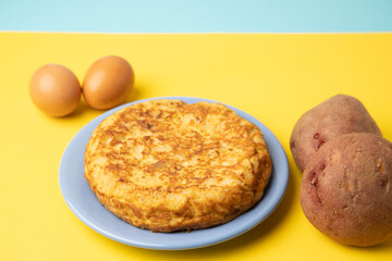 omelette with potatoes on yellow background