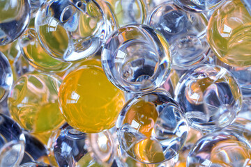 Lots of clear gel scent beads. Yellow and transparent. Hygiene and health. Close-up. Macro.