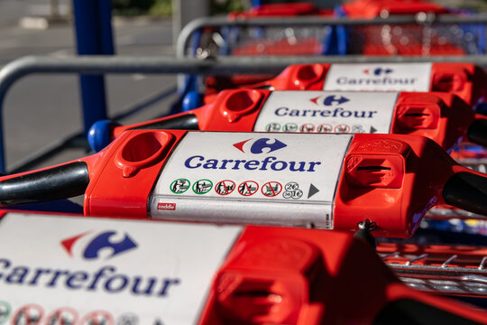 Lomme,FRANCE-February 24,2019: Close-up shopping trolleys Carrefour supermarket.Carrefour is an international French network of hypermarkets and supermarkets, founded in 1959. 