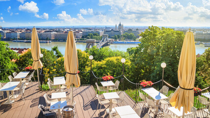 Fototapeta premium City summer landscape - top view from the cafe to the historic center of Budapest on a hot summer day, Hungary