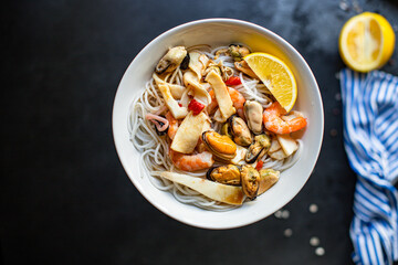 rice noodles seafood cellophane pasta shrimp, mussels, squid ingredient for preparing healthy meal snack top view copy space for text food background rustic