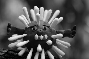 Figure of a virus made of plasticine close-up.
