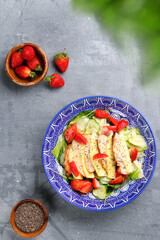 salad with chicken and mango. salad and ingredients on concrete table top view