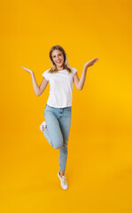 Happy beautiful girl smiling while showing copyspace