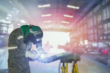 Welder industrial in factory welding process TIG with gas argon, light spark from working light...