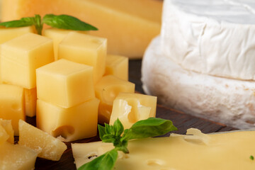 Cut pieces of hard cheese close up