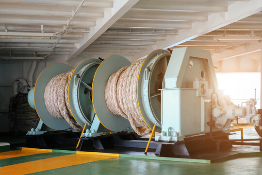 Mooring winch or Mooring windlass during ship moored in port with winch rope in drump.