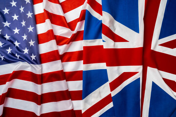 Fototapeta na wymiar Flags of Great Britain and USA folded together