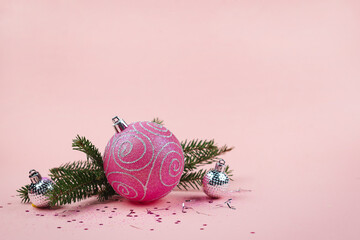 Christmas composition. Christmas pink decorations in pastel pink tones, copy space