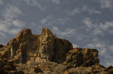 Rocky cliff and clouds in Medio Almud. Mogan. Gran Canaria. Canary Islands. Spain.