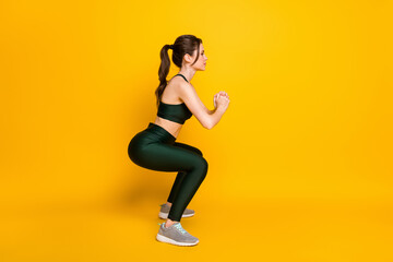 Fototapeta na wymiar Full length body size profile side view of her she nice attractive focused slender girl doing sit-ups isolated over bright yellow color background