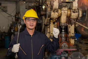 Mechanic engineer wearing cloth gloves, hand wrench tool.