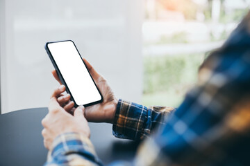 cell phone blank white screen mockup.woman hand holding texting using mobile on desk at office.background empty space for advertise.work people contact marketing business,technology