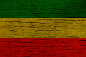 Green yellow red on wood texture background, reggae background.