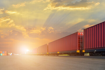 Obraz premium Cargo train platform with freight train Containers on Transport of cargos by rail in container, railway infrastructure on sunset background.
