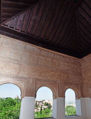 Fototapeta premium Detail of arabic carvings in the Alhambra of Granada, inside view. Andalusia, Spain