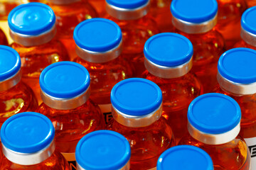 Pile of vaccine or medication vial bottles
