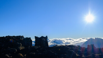 Panoramic view over the mountains of Reunion Island with a sea of fog 