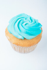 Cupcake with cream isolated on white