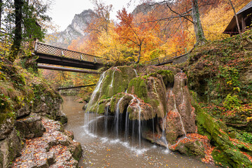 Bigar Waterfall in the Romanian mountains - amazing view of one of the most beautiful waterfalls in Europe during an autumn day with great fall colors